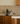 Kitchen counter with coffee maker and La Marzocco espresso machine against a tiled wall.